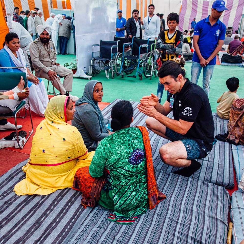 Life West student discussing chiropractic during a service trip to India